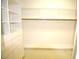 Bright walk-in closet with ample shelving and drawers at 2418 Berkshire Dr, Winter Haven, FL 33884