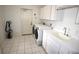 Laundry room with washer, dryer, and utility sink at 2418 Berkshire Dr, Winter Haven, FL 33884