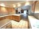 Kitchen with light wood cabinets, tile floors, and an island at 2418 Berkshire Dr, Winter Haven, FL 33884