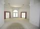 Spacious living room with high ceilings and carpet at 2418 Berkshire Dr, Winter Haven, FL 33884