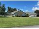 House exterior with three-car garage and large lot at 2418 Berkshire Dr, Winter Haven, FL 33884