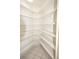Walk-in pantry with numerous shelves for storage at 2418 Berkshire Dr, Winter Haven, FL 33884