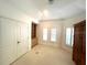 Large bedroom with built-in shelving and ample closet space at 2418 Berkshire Dr, Winter Haven, FL 33884
