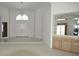 Spacious entryway with built-in shelving and tiled floors at 2418 Berkshire Dr, Winter Haven, FL 33884