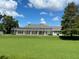 House with a large backyard and screened pool area at 2418 Berkshire Dr, Winter Haven, FL 33884
