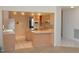 Kitchen with light wood cabinets and tile floors at 2418 Berkshire Dr, Winter Haven, FL 33884