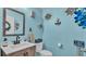 Light and bright bathroom with coastal decor at 411 Sunfish Dr, Winter Haven, FL 33881