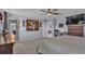 Bright bedroom with a dresser, large TV, and ocean art at 411 Sunfish Dr, Winter Haven, FL 33881