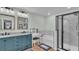 Elegant bathroom with double vanity, soaking tub, and walk-in shower at 411 Sunfish Dr, Winter Haven, FL 33881