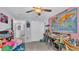 Pink bedroom with craft station and map at 411 Sunfish Dr, Winter Haven, FL 33881