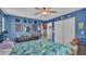 Blue bedroom with double bed and charming decor at 411 Sunfish Dr, Winter Haven, FL 33881