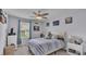 Bedroom with striped bedding and plenty of natural light at 411 Sunfish Dr, Winter Haven, FL 33881