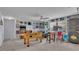 Fun game room includes foosball table, arcade game, and dartboard at 411 Sunfish Dr, Winter Haven, FL 33881