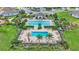 Two community pools with surrounding patio and landscaping at 411 Sunfish Dr, Winter Haven, FL 33881