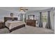 Large main bedroom with dresser, TV, and ceiling fan at 411 Sunfish Dr, Winter Haven, FL 33881