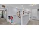 Upstairs hallway with access to bedrooms and laundry at 411 Sunfish Dr, Winter Haven, FL 33881