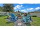 Charming firepit area with colorful Adirondack chairs at 411 Sunfish Dr, Winter Haven, FL 33881