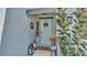 Front door with welcome decor and landscaping at 411 Sunfish Dr, Winter Haven, FL 33881