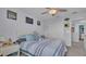 Bedroom with striped bedding and closet at 411 Sunfish Dr, Winter Haven, FL 33881