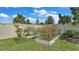 Landscaped garden with raised beds and various plants at 411 Sunfish Dr, Winter Haven, FL 33881