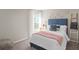 Cozy bedroom with a full-size bed, featuring a soft pink blanket and decorative pillows at 1254 Chester Ave, Haines City, FL 33844