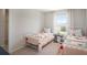 Bedroom with twin beds featuring delicate floral bedding at 1254 Chester Ave, Haines City, FL 33844
