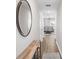 Bright hallway with wood floors and view into the living room at 1254 Chester Ave, Haines City, FL 33844