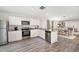 Kitchen with white cabinets, granite countertops, stainless steel appliances at 2242 Majestic Span Ave, Eagle Lake, FL 33839