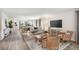 Open living room with hardwood floors, neutral color palette, and comfy seating at 2242 Majestic Span Ave, Eagle Lake, FL 33839