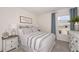 Bedroom with striped bedding and window at 1250 Chester Ave, Haines City, FL 33844