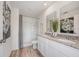 Bathroom with shower, double vanity, and granite countertop at 1250 Chester Ave, Haines City, FL 33844
