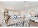 Bright dining area with a rustic farmhouse table and white chairs at 2093 Golden Beak Dr, Eagle Lake, FL 33839