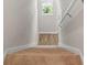 Carpeted stairs leading to the upper level of the home at 989 Ambleside Dr, Haines City, FL 33844