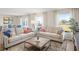 Spacious living room with large windows and comfortable seating at 989 Ambleside Dr, Haines City, FL 33844