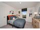 Charming bedroom with baseball-themed decor and a comfortable bed at 1261 Chester Ave, Haines City, FL 33844