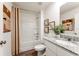 Clean bathroom with granite countertop, a bathtub, and neutral decor at 1261 Chester Ave, Haines City, FL 33844