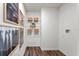 Bright laundry room with wire shelving and space for storage at 1261 Chester Ave, Haines City, FL 33844