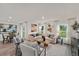 Open living room with hardwood floors, neutral decor, and access to a backyard at 1261 Chester Ave, Haines City, FL 33844