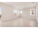 Spacious living room with tile floors and multiple windows at 2350 Selenia St, Lake Alfred, FL 33850