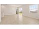 Bright dining room with tile floors, sliding glass doors, and chandelier at 2350 Selenia St, Lake Alfred, FL 33850