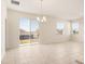 Bright dining room with tile floors, sliding glass doors, and a chandelier at 2350 Selenia St, Lake Alfred, FL 33850