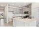 Open concept kitchen with island and stainless steel appliances at 2350 Selenia St, Lake Alfred, FL 33850