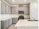 Modern kitchen with stainless steel appliances and island at 2350 Selenia St, Lake Alfred, FL 33850