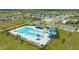 Community pool with spacious deck and surrounding landscaping at 2350 Selenia St, Lake Alfred, FL 33850