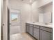 Modern bathroom with double vanity and access to bedroom at 2350 Selenia St, Lake Alfred, FL 33850