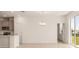 Spacious dining area with tile floors, chandelier, and access to patio at 2350 Selenia St, Lake Alfred, FL 33850