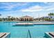 Community pool with a large deck and pool house at 2350 Selenia St, Lake Alfred, FL 33850