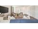 Bright living room features comfy seating, a large TV, and stylish decor at 2235 Majestic Span Ave, Eagle Lake, FL 33839