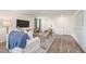 Cozy living room with neutral decor and hardwood floors at 2235 Majestic Span Ave, Eagle Lake, FL 33839
