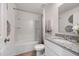 Clean bathroom with a tub, granite countertop, and neutral decor at 2235 Majestic Span Ave, Eagle Lake, FL 33839